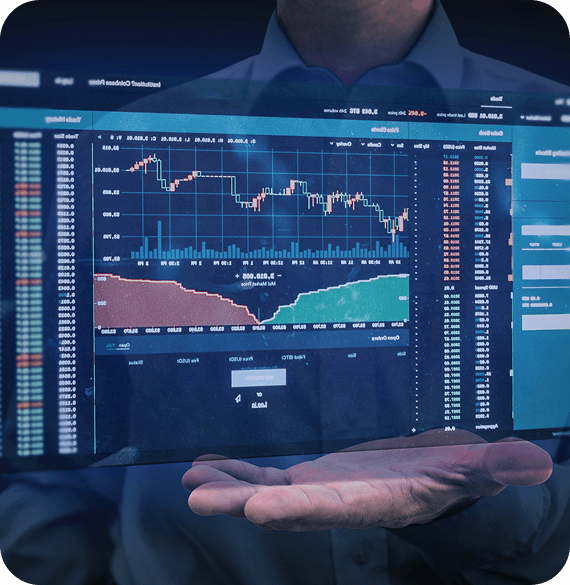 Person in front of a futuristic transparent display showing trading charts